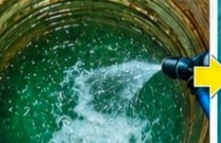 High pressure jet cleaning the inside of a water tank